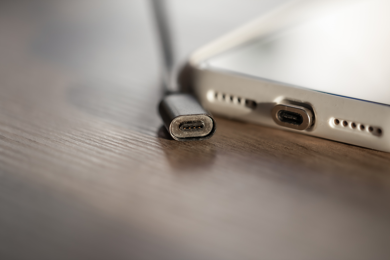 Phone charging port being repaired on the spot