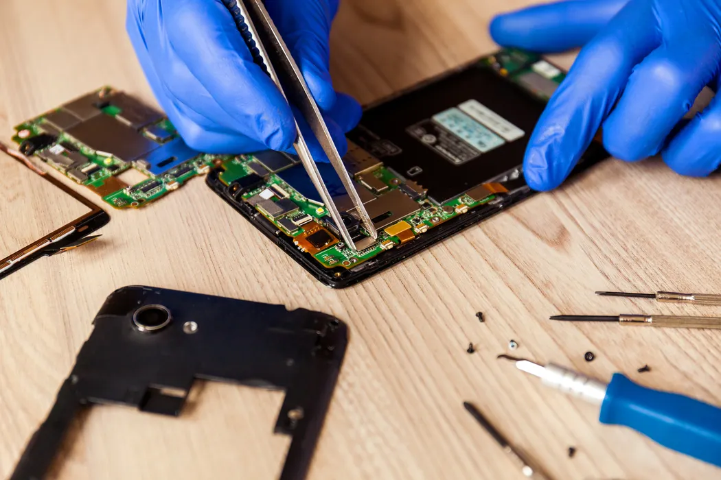 Phone battery being replaced at customer home in Trinidad