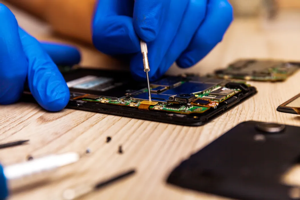 Phone camera and back glass being repaired on the spot